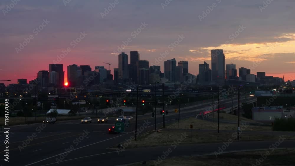 The distinctive Denver skyline at dawn, with traffic headlights in the foregrounds. 4K UHD timelapse. The distinctive Denver skyline at dawn, with traffic headlights in the foregrounds. 4K UHD timelapse.