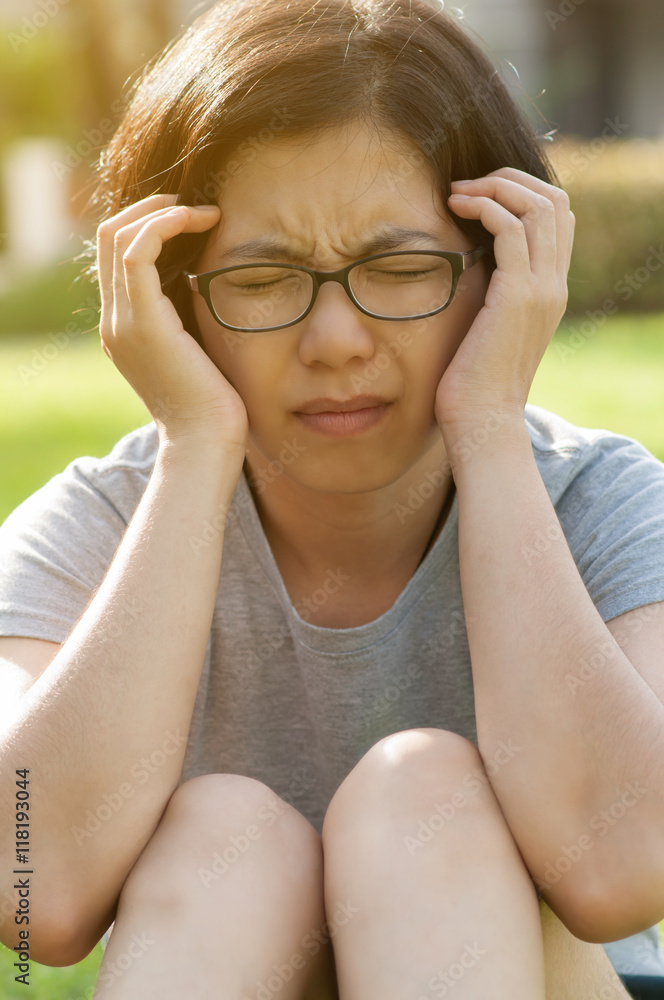Asian glasses woman having headache. Asian glasses woman having headache.