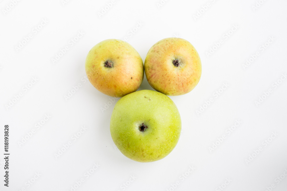Three apples on a white background green red Three apples on a white background green red
