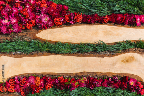 Flowers and wooden background. Top view, copy space