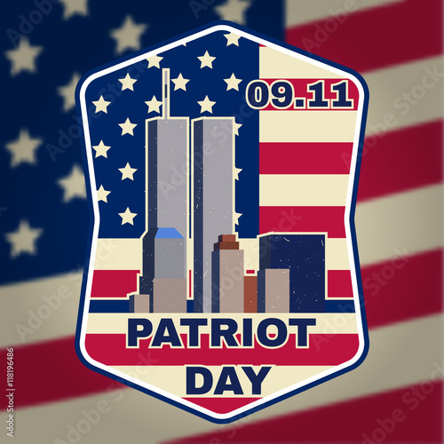Patriot day badge emblem with buildings and American flag.