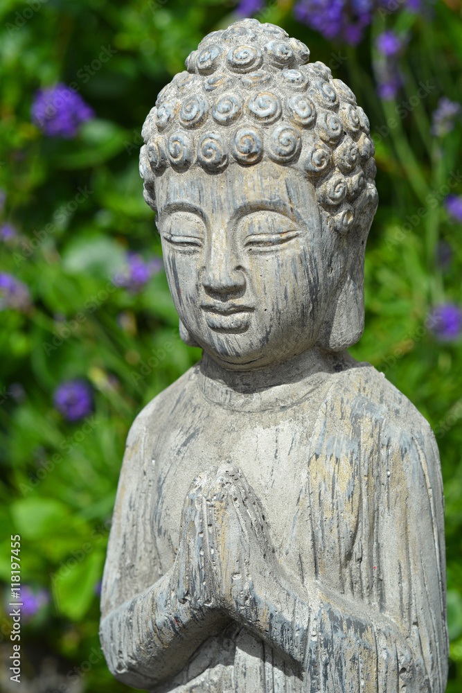 Buddha statue in a lavender garden Buddha statue in a lavender garden