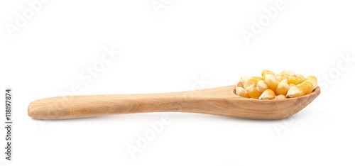 Wooden spoon filled with corn