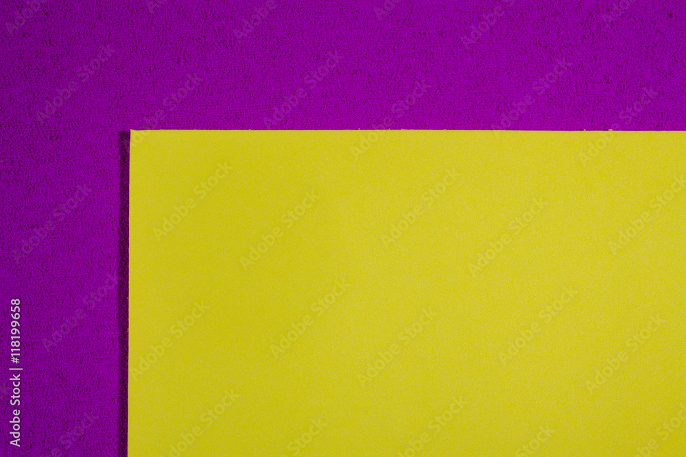 Eva foam ethylene vinyl acetate smooth lemon yellow surface on pink sponge plush background Eva foam ethylene vinyl acetate smooth lemon yellow surface on pink sponge plush background