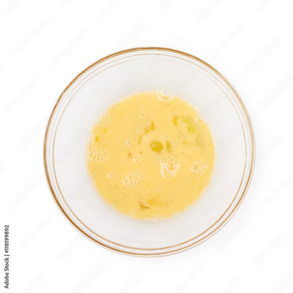 Whisked eggs in a glass bowl isolated Whisked eggs in a glass bowl isolated