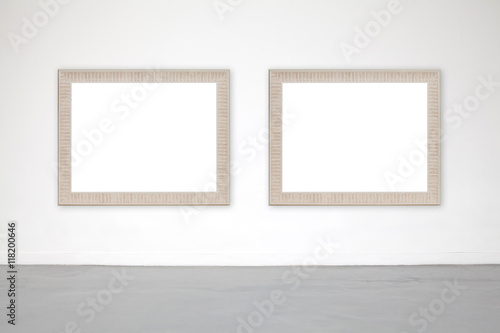 Classic frame on white cement wall in showroom and gallery. © suwanphoto