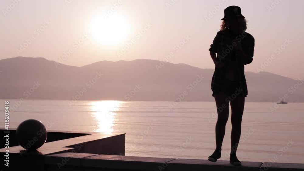 silhouette of a dancing teen girl at sunrise Stock Video | Adobe Stock
