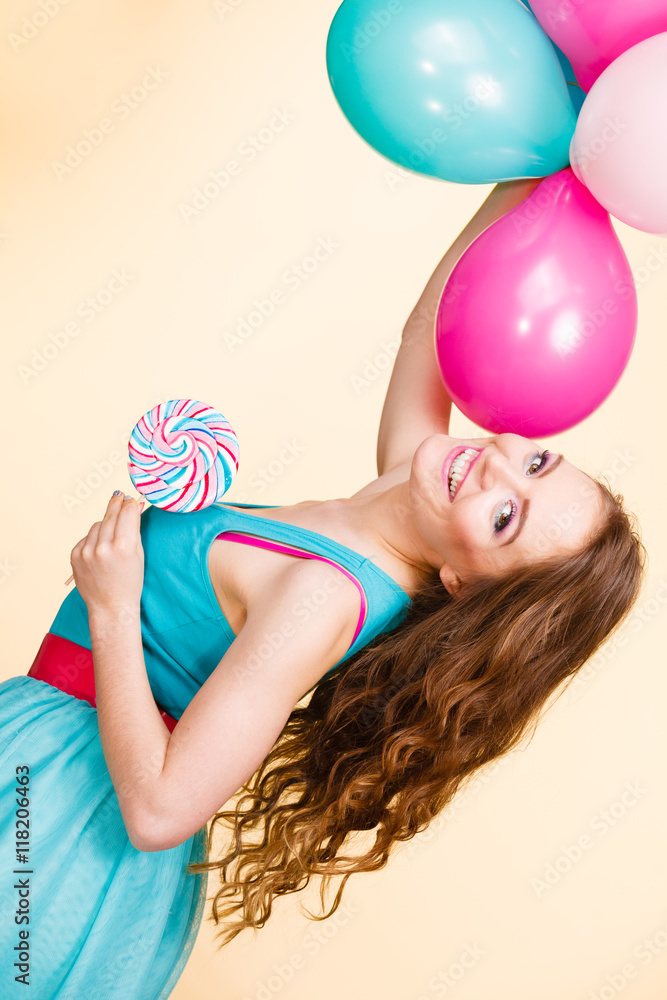 Woman with colorful balloons and lollipop Woman with colorful balloons and lollipop