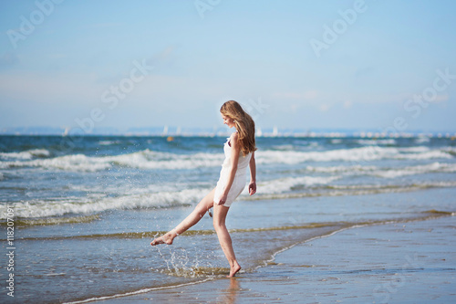 Young woman enjoying her vacation by sea