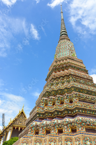beautiful pagoda with blue sky background at Wat Pho temple, Bangkok, Thailand © iamtui7