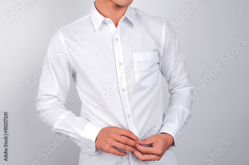 A man wearing a white shirt. White background