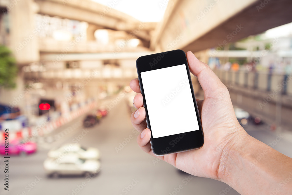Person using smartphone white screen holder on hand with blurry Person using smartphone white screen holder on hand with blurry
