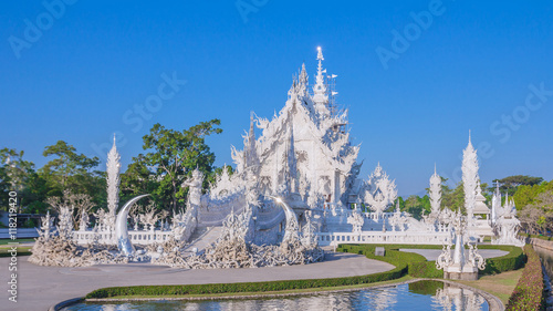 Wat Rong Khun, Chiang Rai province, northern Thailand Magnificently grand white church and reflection in the water. The white temple of Chiang Rai