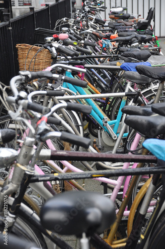 Row of bicycles on a parking in Amsterdam, Netherlands