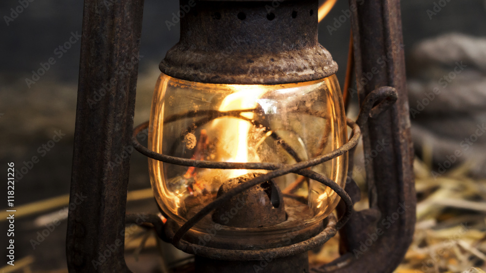 Fototapeta premium Old lantern on wooden background