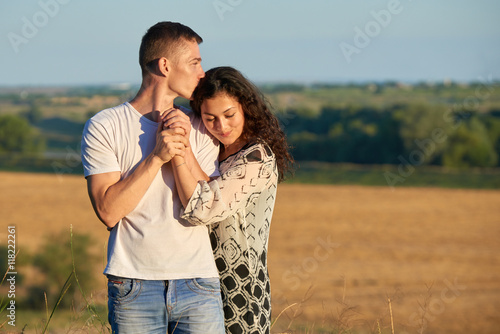 happy young couple posing high on country outdoor, romantic people concept, summer season