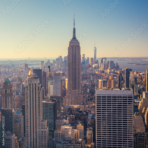 view of Manhattan skyline and skyscrapers at sunrise, New York C © Taiga