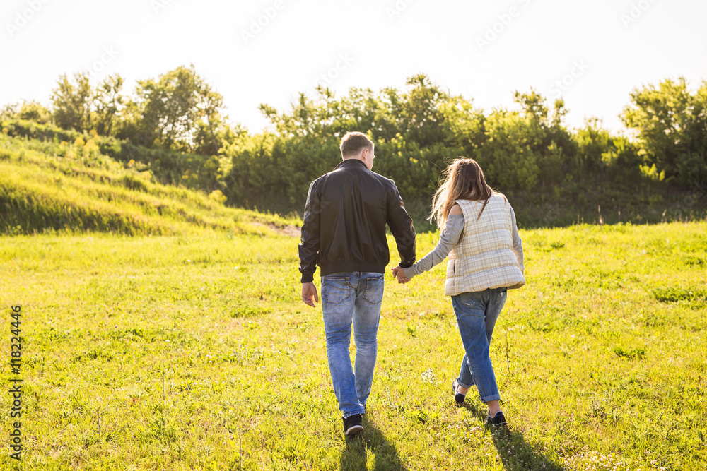 Couple Holding Hands Walking Away