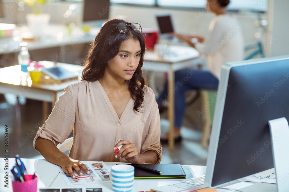 Businesswoman using graphic tablet