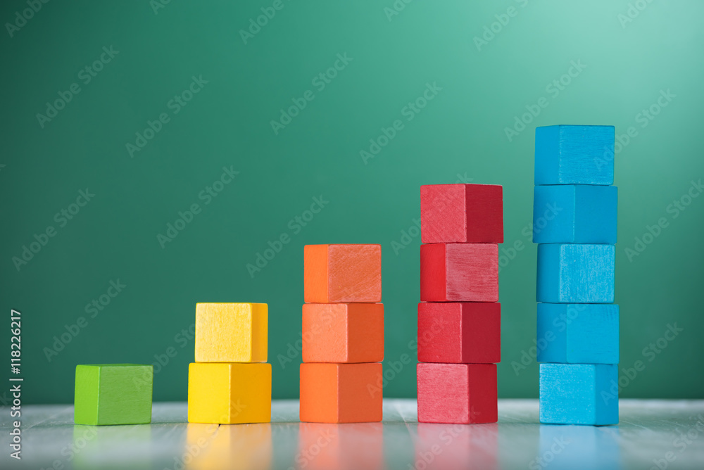 Naklejka premium Colorful stack of wood cube building blocks