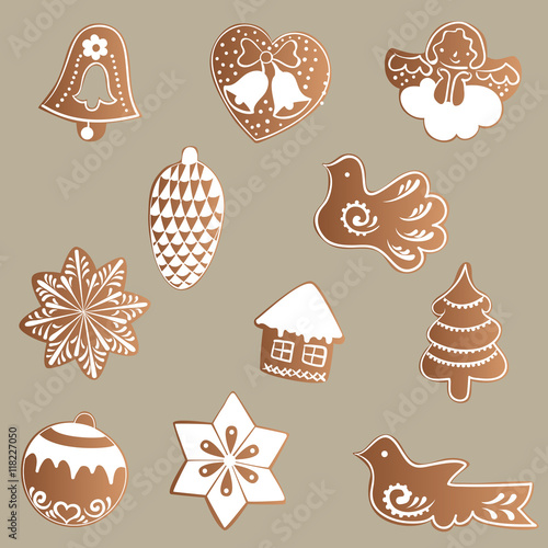 Drawing of a Set of gingerbread with white icing with a Christmas, New Year, theme on a brown background - bell, heart, angel, pine cone, birds, stars, house, tree, ball