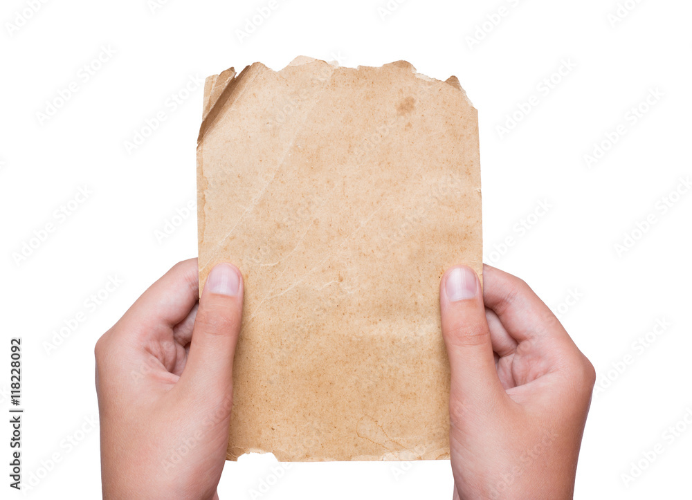 Young hands holding vintage paper sheet isolated