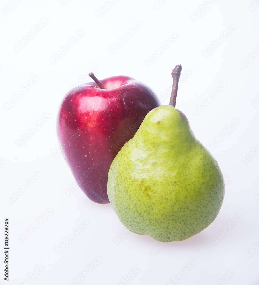 red apple and green pear on a background. red apple and green pear on a background.