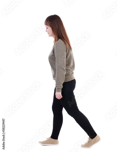 back view of walking woman. beautiful blonde girl in motion. backside view of person. Rear view people collection. Isolated over white background. She goes down to the right hand.