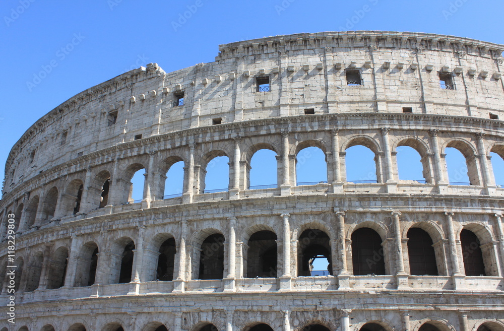 Great Colosseum in Rome, Italy, Europe. Roman Coliseum close-up with clear blue sky.