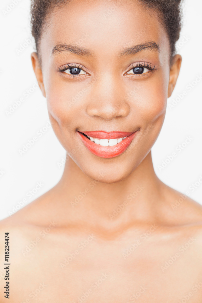 Portrait of woman wearing lipstick looking at camera smiling Portrait of woman wearing lipstick looking at camera smiling