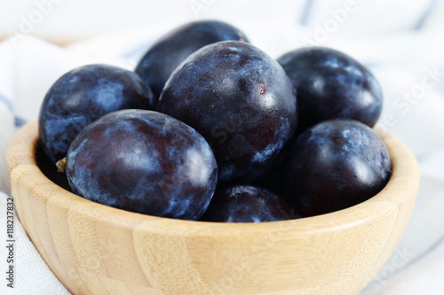 Wallpaper Mural Fresh ripe plums in wooden bowl Torontodigital.ca