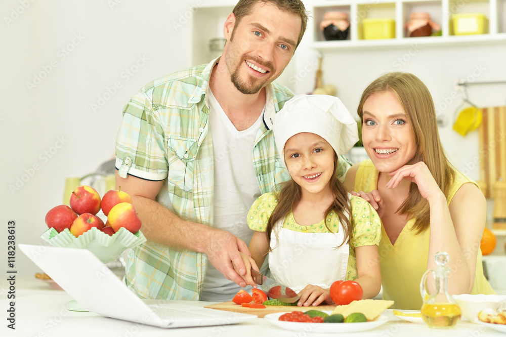 happy family cooking  in kitchen