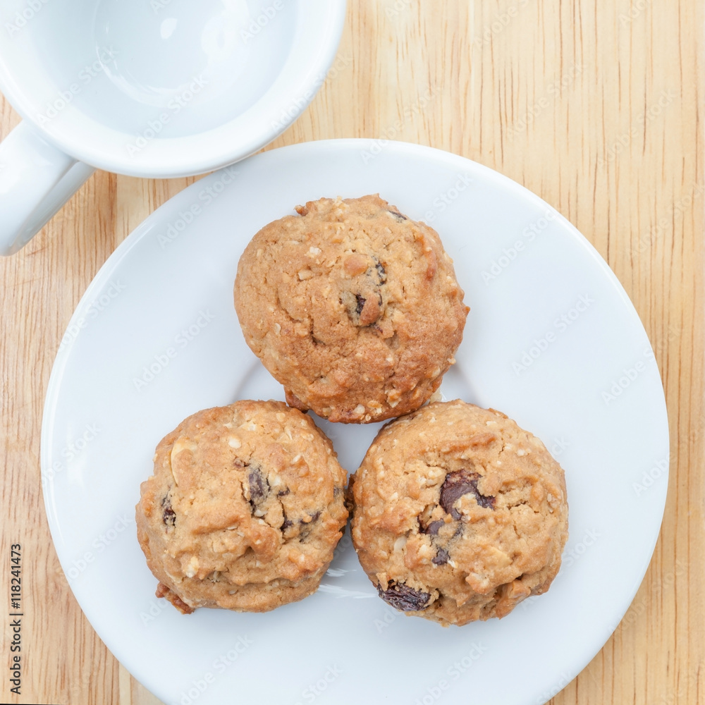 A plate of oatmeal cookies ready to be served for afternoon tea. A plate of oatmeal cookies ready to be served for afternoon tea.