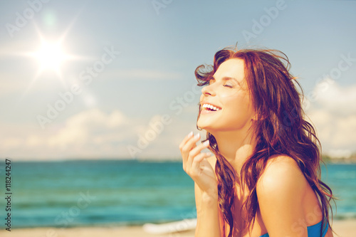 laughing woman on the beach