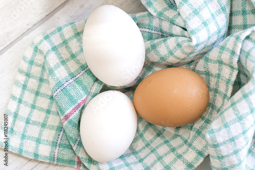 Group of three eggs on colored cloth