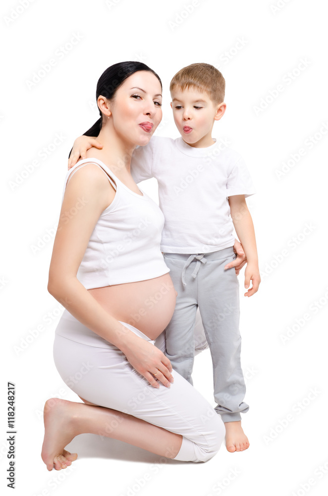 Beautiful young pregnant woman with son showing tongue Beautiful young pregnant woman with son showing tongue