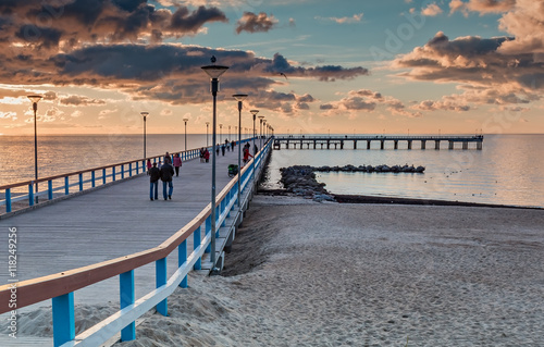 Colorful sunset at a famous marine pier in resort city of Palanga, Lithuania,...