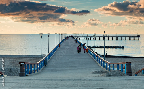 Colorful sunset at a famous marine pier in resort city of Palanga, Lithuania,...