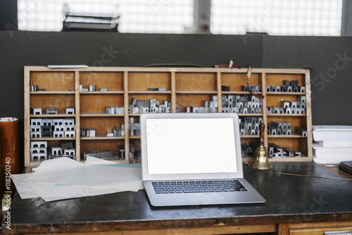 Laptop in typesetting shop photo