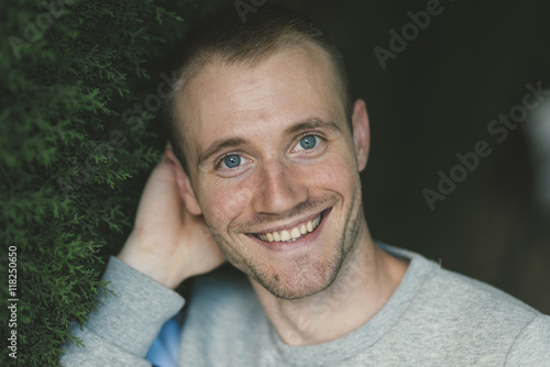 Portrait of smiling blue-eyed man photo