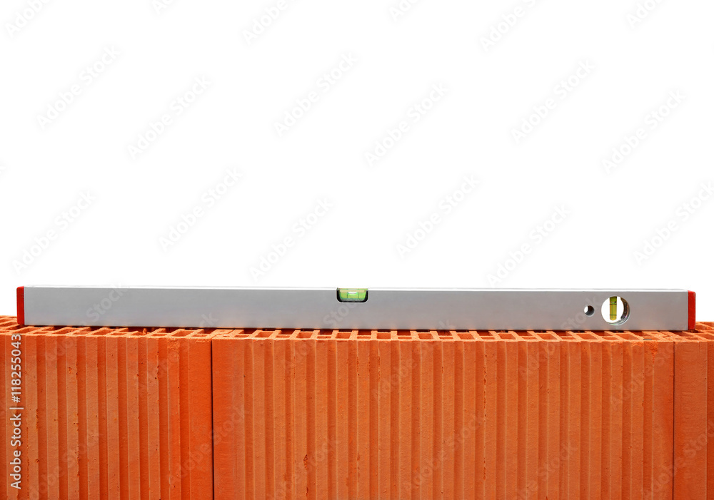 Spirit level on brick wall. Bricklaying work. Spirit level on brick wall. Bricklaying work.