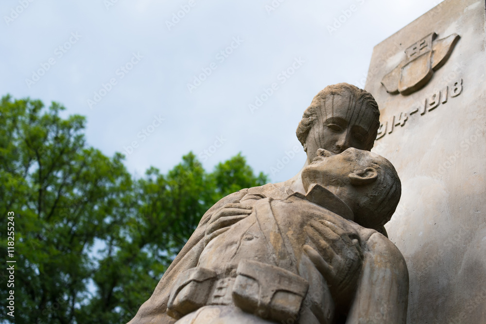Pieta from first world war - mother / wife is mourning and holding dead body of son / husband. Memorial for killed soldiers on cemetery in Petrvald, Czech Republic