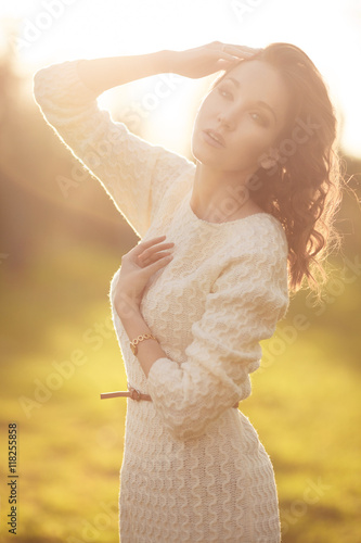 Beautiful young woman autumn outdoors , girl in knitted sweater photo