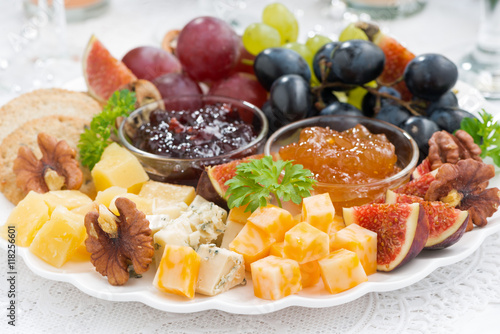 cheese and fruit plate to the holiday, closeup