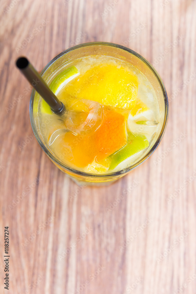 Lemonade juice with orange on wooden background Lemonade juice with orange on wooden background