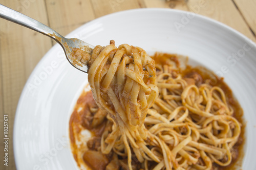 fresh homecook spaghett on wooden table photo