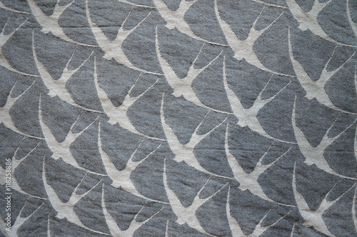 Grey swallow pattern on beige background pattern material