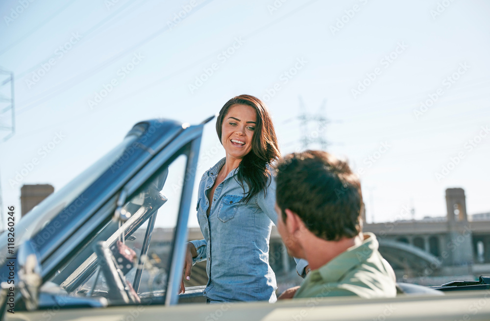 Couple in convertible car, Los Angeles, California, USA Couple in convertible car, Los Angeles, California, USA