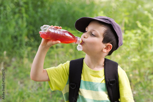 Child drinking outdoors
