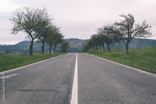 Wallpaper Mural simple country road in summer - vintage film effect Torontodigital.ca